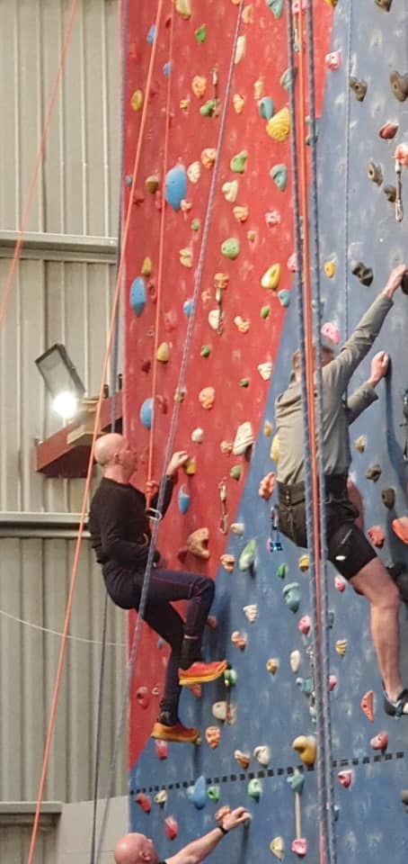 Tony climbing wall